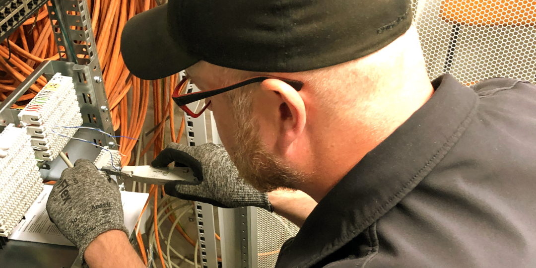 Interflex employee installs lift controller